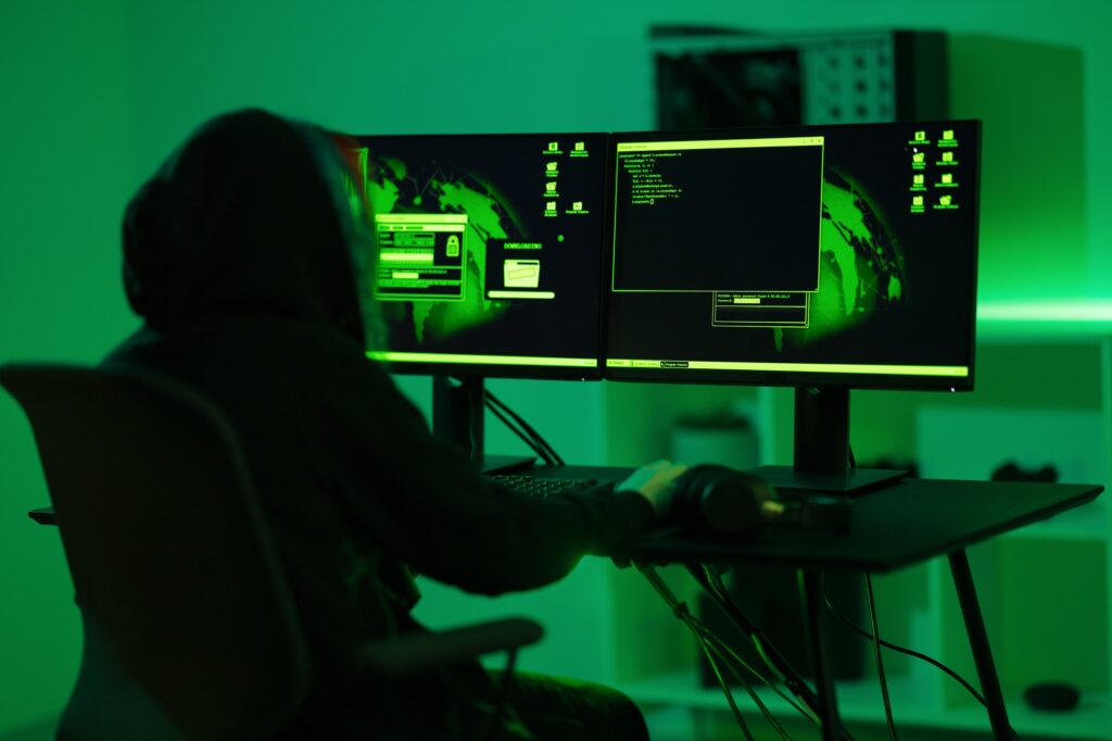 Cyber security hacker code harmful software to exploit vulnerability in program or system in dark